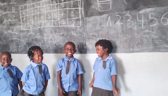 Kids at a blackboard Kids at a blackboard